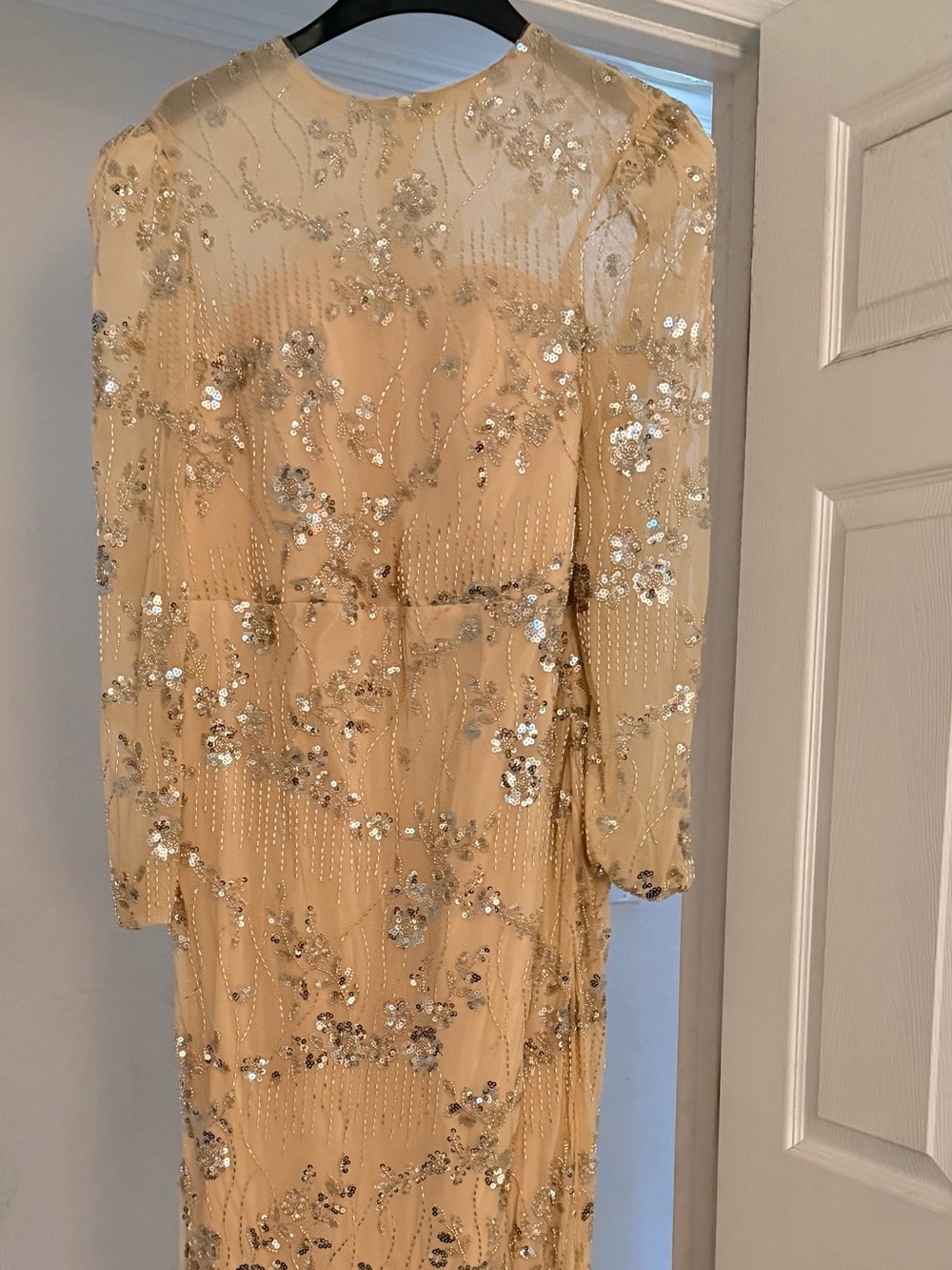 Embellished Cream Long-Sleeve Wedding Gown, floor length with back slit.